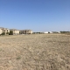 commercial lot land with apartment buildings in the background