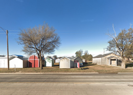 picture of lot with small whit storage units on it