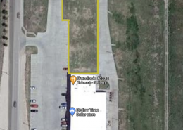 google satellite image of aerial view of walmart with a logo on the building and yellow outlined piece of land to the north of walmart
